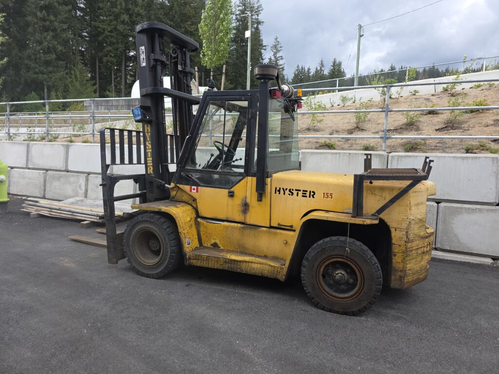 Scrap forklift removal in North Vancouver - yellow Hyster 155 picked up for cash